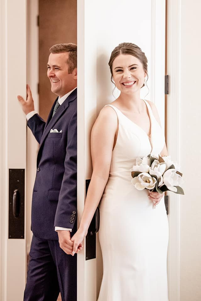 First Look Birde and Groom Behind Door