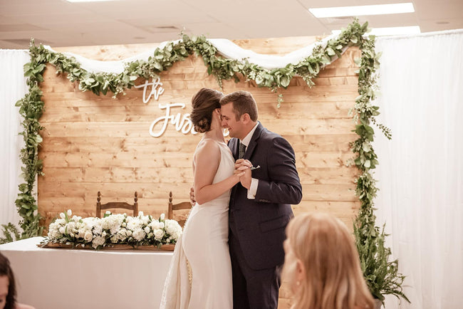 Bride and Groom First Dance in front of Sweet Heart Table