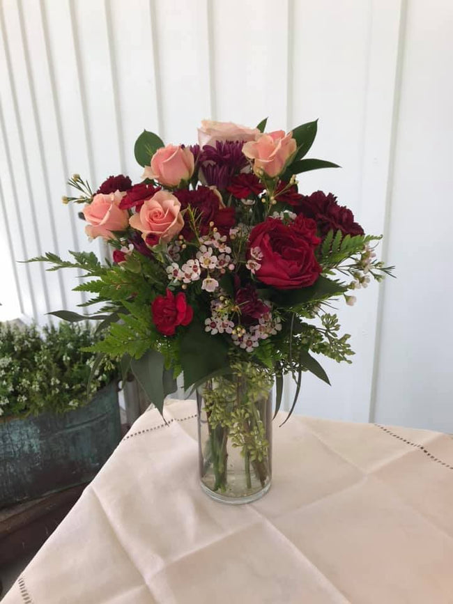 Wedding Flower Centerpiece with red and pink roses in a western style